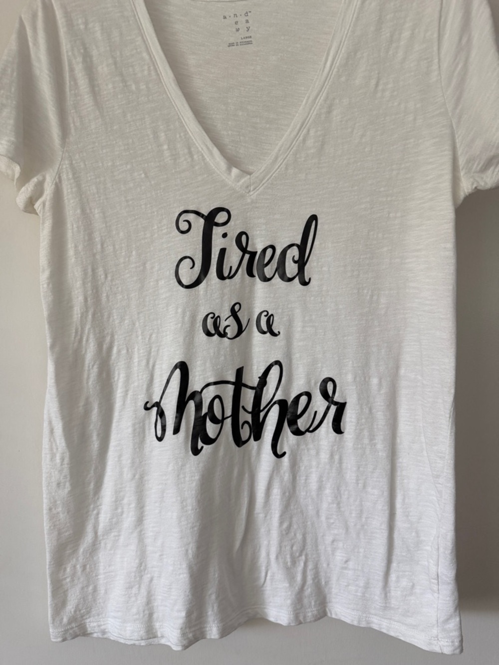 a new day White V-Neck Tee with Black Script "Tired as a Mother"
